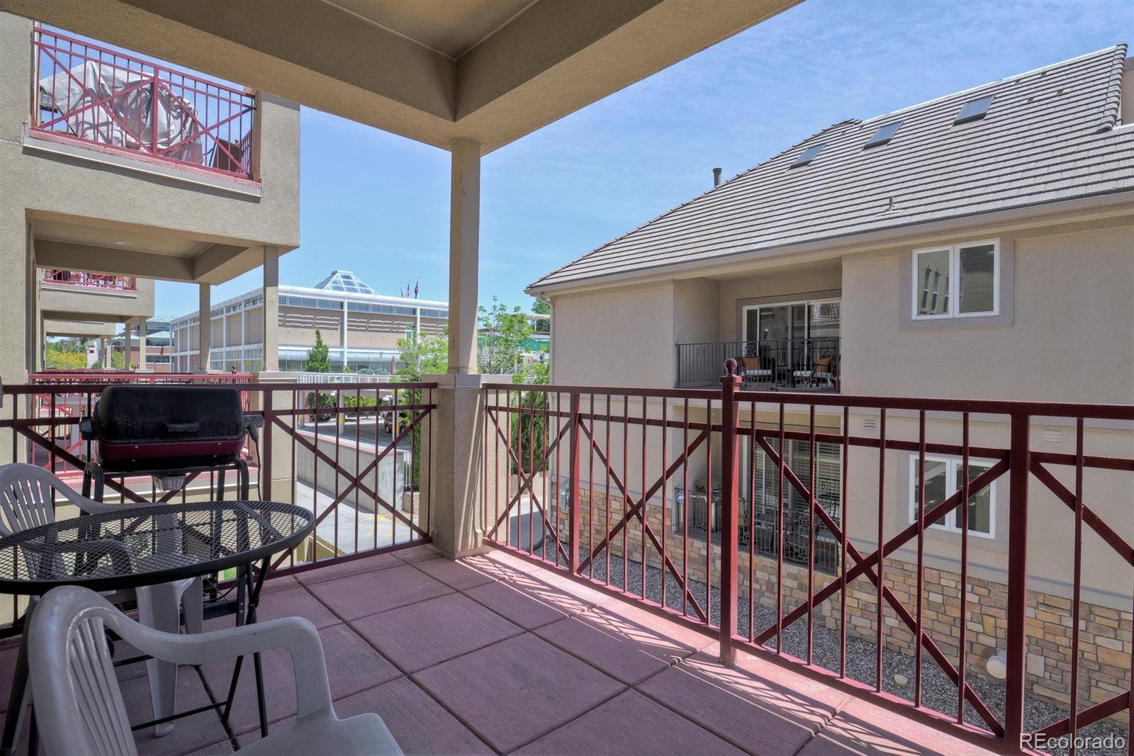40 Madison Street, Unit 208 Denver, CO 80206 - Photo 20 of 20 a view of a balcony with chairs