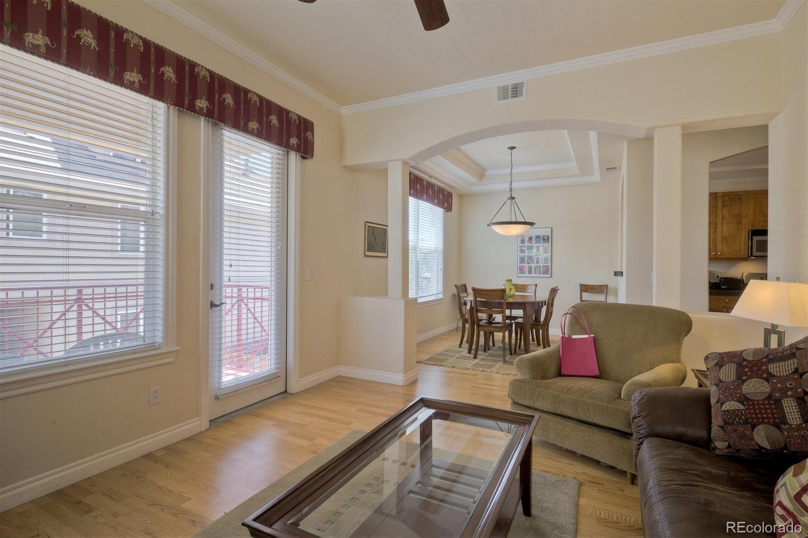 40 Madison Street, Unit 208 Denver, CO 80206 - Photo 6 of 20 a living room with furniture and a window