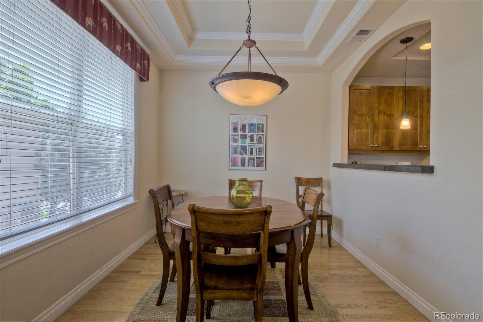 40 Madison Street, Unit 208 Denver, CO 80206 - Photo 7 of 20 a view of a dining room with furniture and chandelier