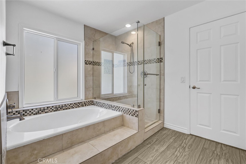 28661 Charreadas Laguna Niguel, CA 92677 - Photo 16 of 29 a spacious bathroom with a bathtub and a shower