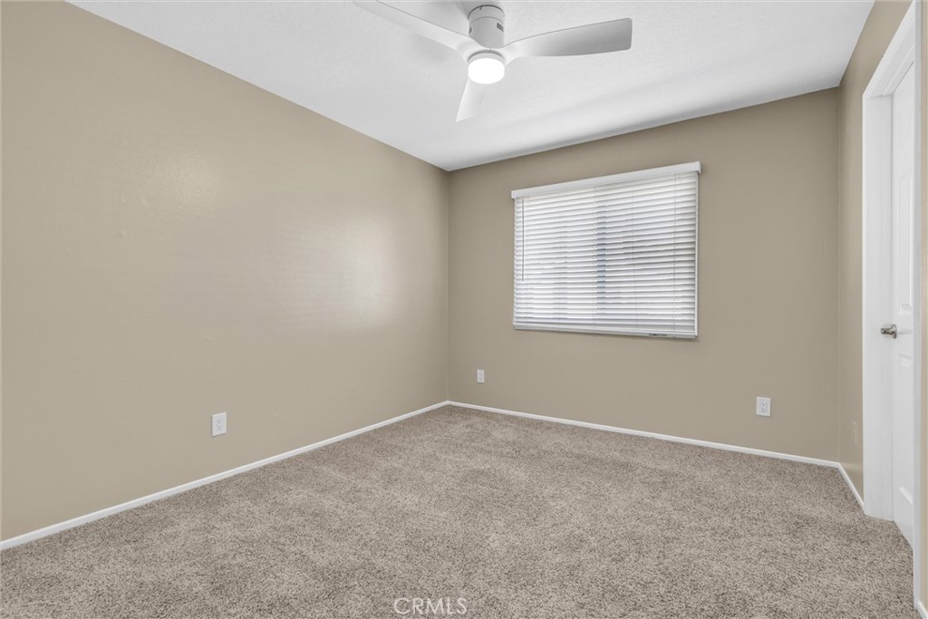 28661 Charreadas Laguna Niguel, CA 92677 - Photo 18 of 29 an empty room with a window and a fan