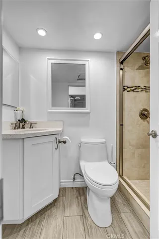 a bathroom with a shower and a toilet