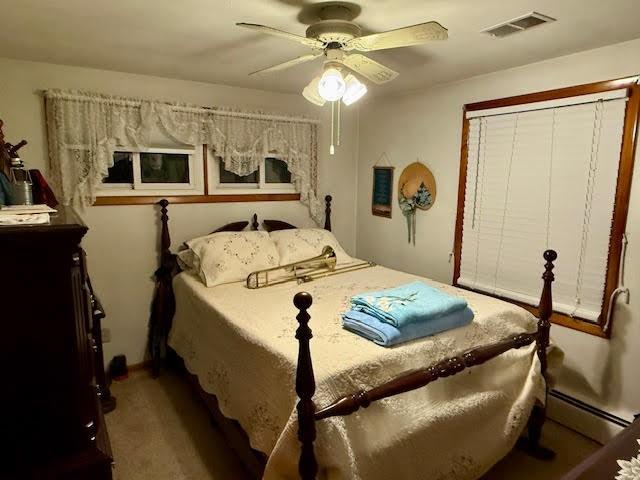 65 Glenn Road Mercer, PA 16137 - Photo 19 of 44 a bedroom with a bed and a chandelier