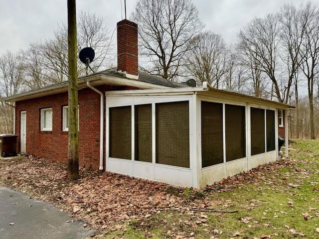 65 Glenn Road Mercer, PA 16137 - Photo 4 of 44 a front view of a house with a garden