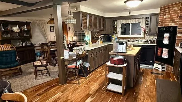 a view of a dining room with lots of furniture and wooden floor