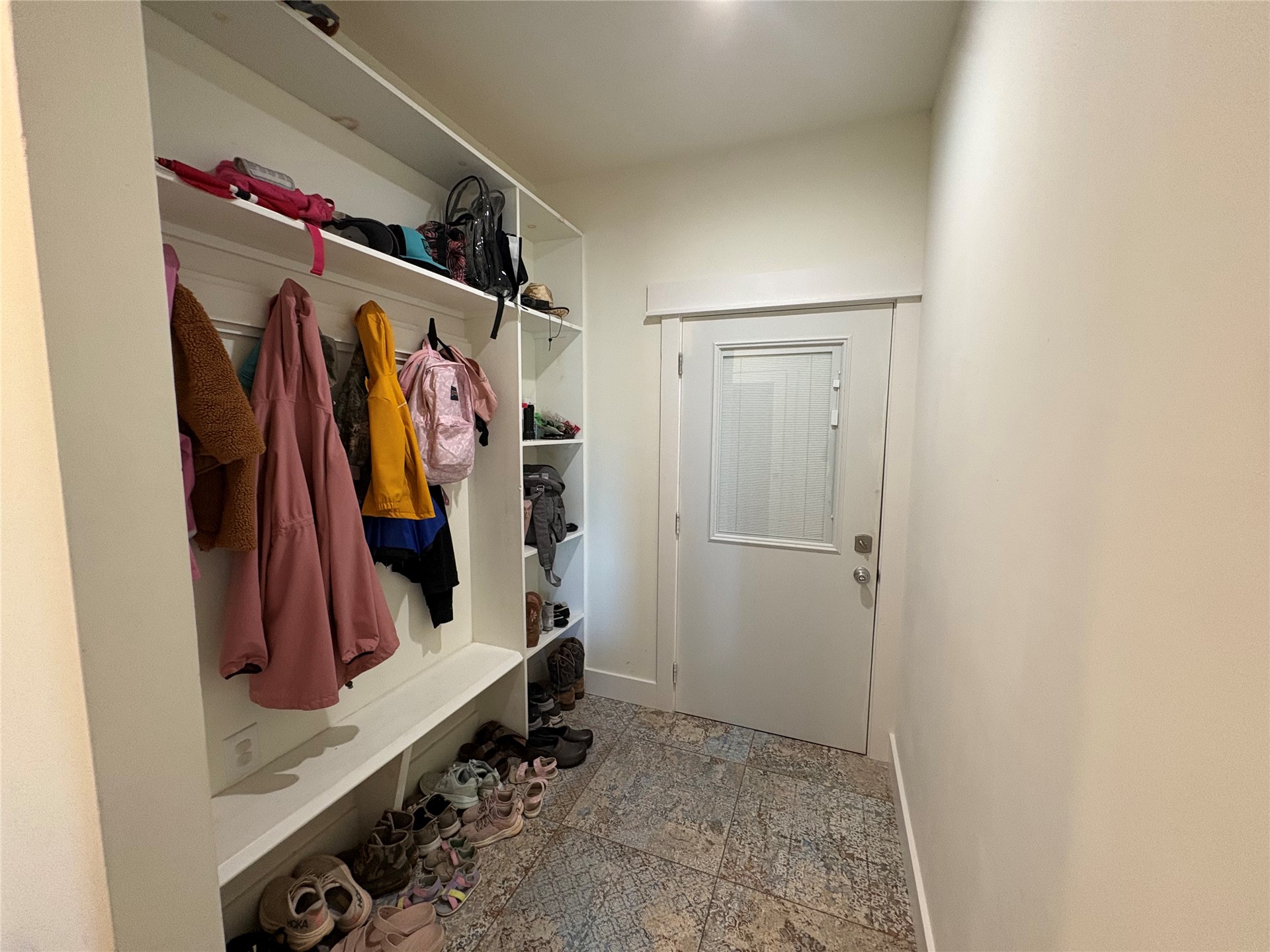 313 Nauvoo Hills Road Caddo, OK 74729 - Photo 21 of 41 Built-in storage system featuring coat hooks, upper shelving, and lower shelving