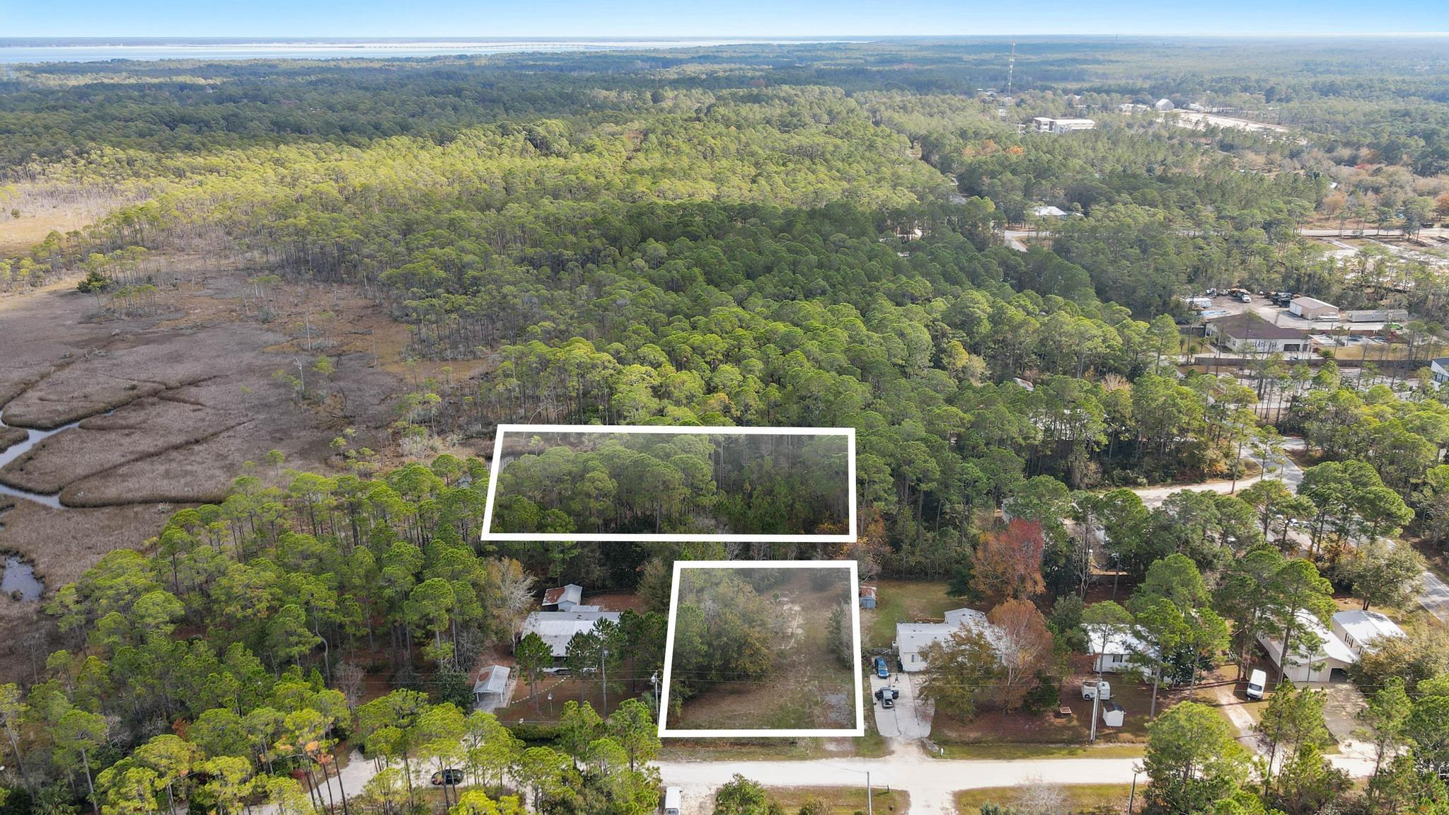 64 21st Street Santa Rosa Beach, FL 32459 - Photo 5 of 16 a view of a yard from a balcony