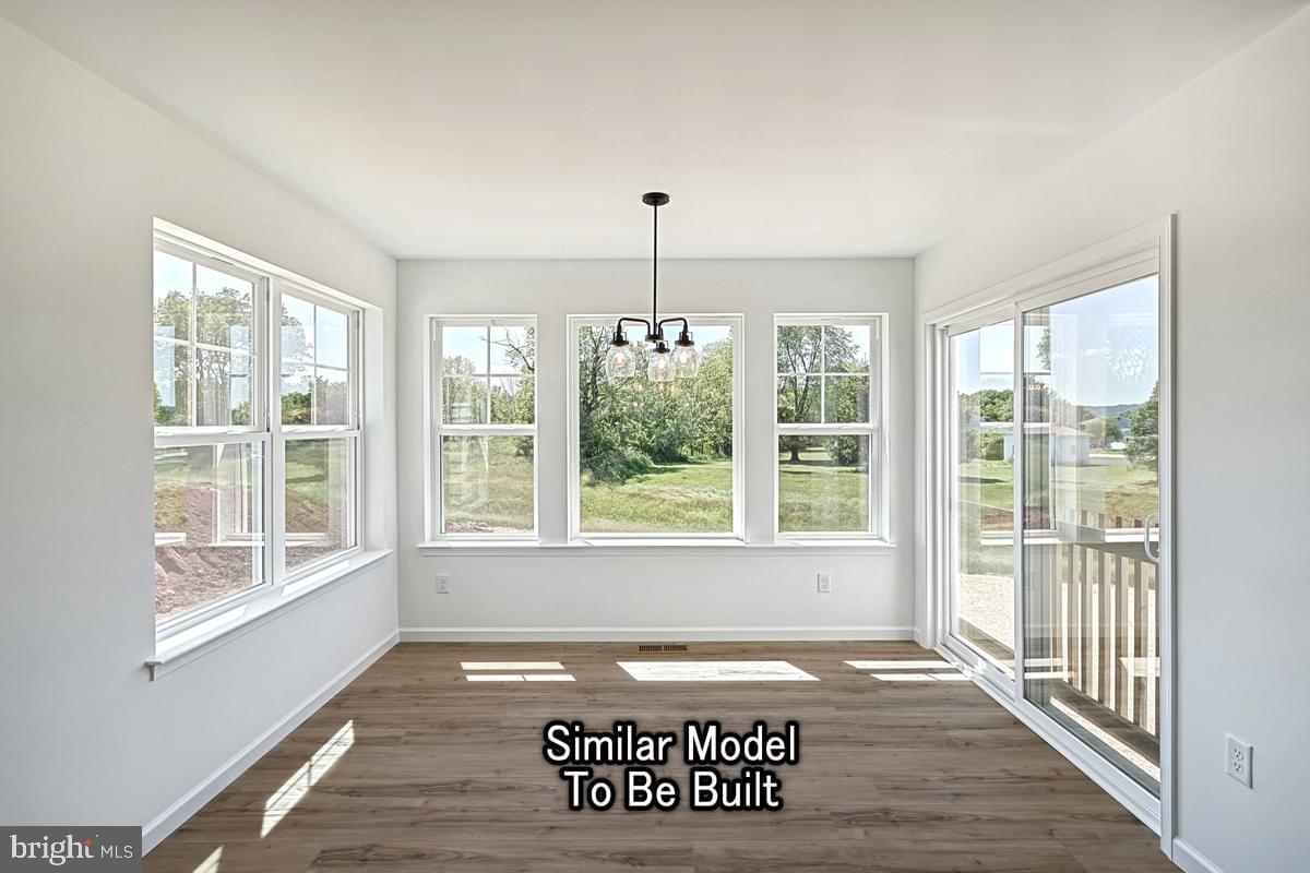 Meriwether Plan At The Seasons Dover, PA 17315 - Photo 16 of 30 a view of a entryway door with wooden floor