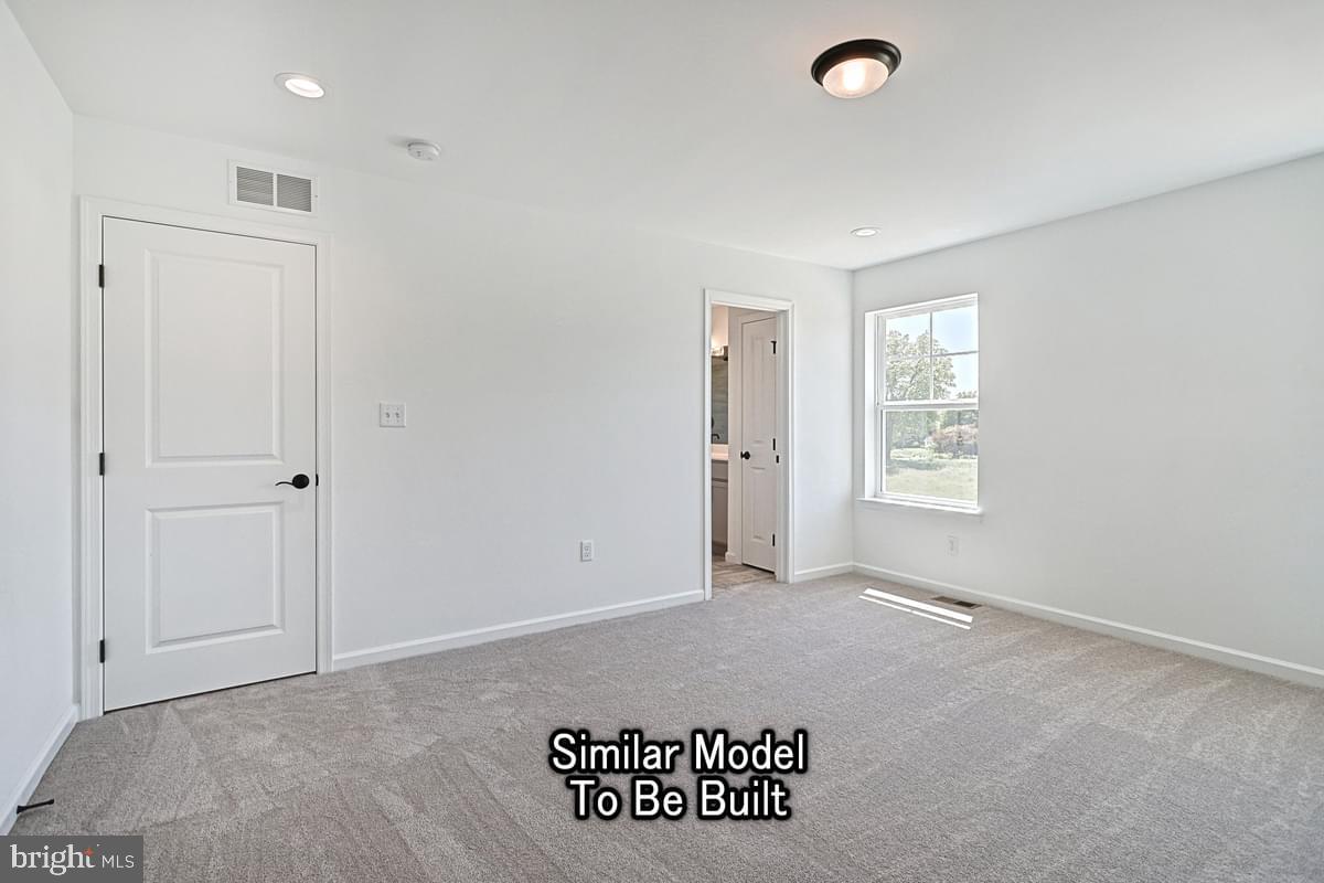 Meriwether Plan At The Seasons Dover, PA 17315 - Photo 17 of 30 an empty room with windows and closet