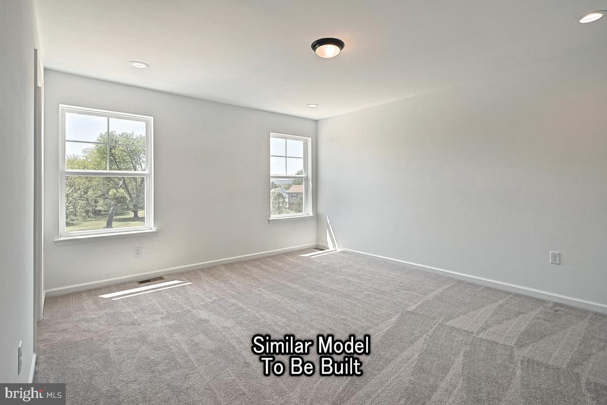 Meriwether Plan At The Seasons Dover, PA 17315 - Photo 18 of 30 an empty room with windows