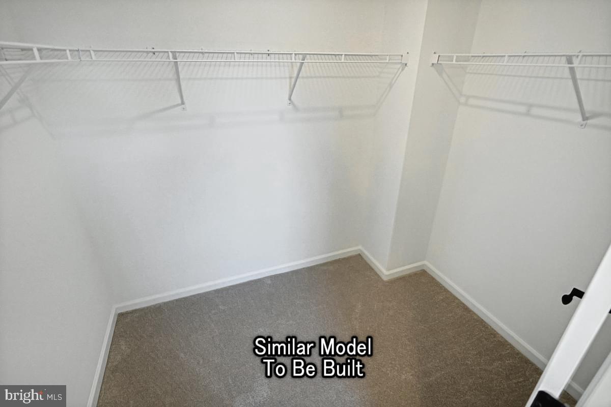 Meriwether Plan At The Seasons Dover, PA 17315 - Photo 22 of 30 a view of a room with racks on the wall