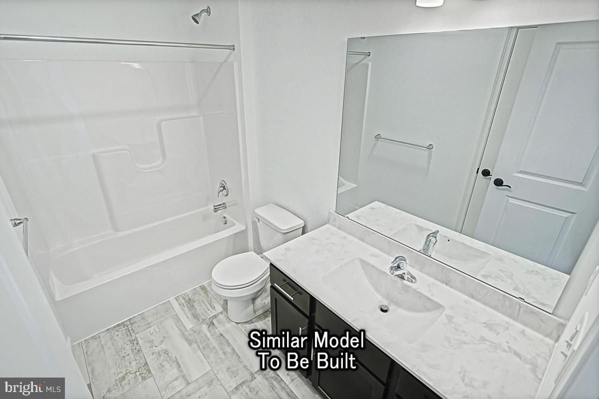 Meriwether Plan At The Seasons Dover, PA 17315 - Photo 28 of 30 a bathroom with a sink a toilet and shower