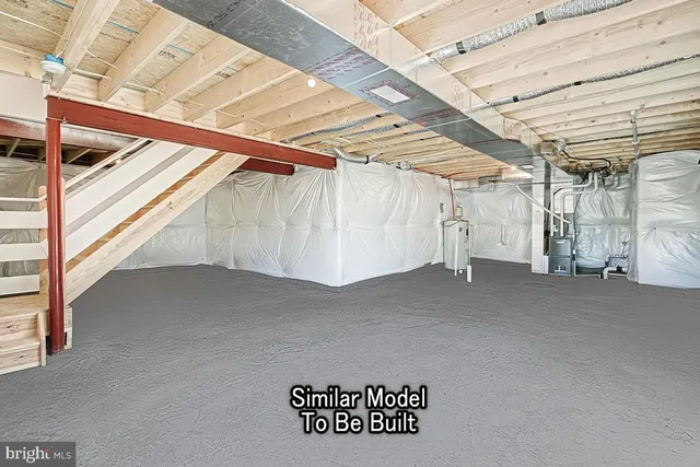 a view of a room with wooden walls and a window