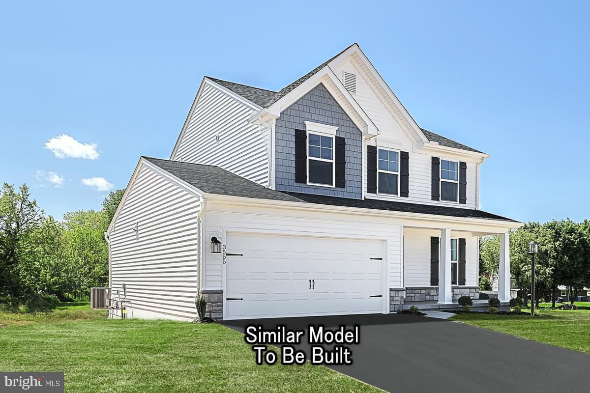 Meriwether Plan At The Seasons Dover, PA 17315 - Photo 3 of 30 a front view of a house with a yard
