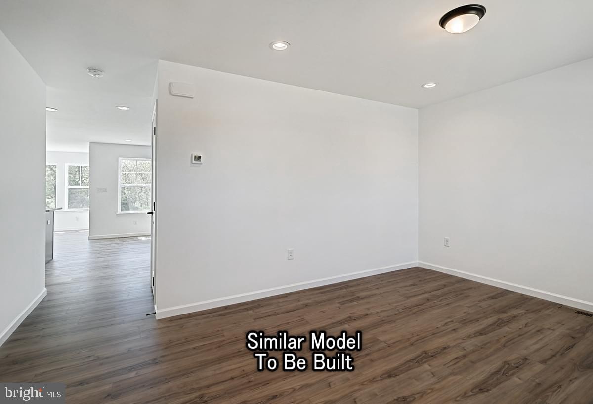 Meriwether Plan At The Seasons Dover, PA 17315 - Photo 5 of 30 a view of an empty room with wooden floor