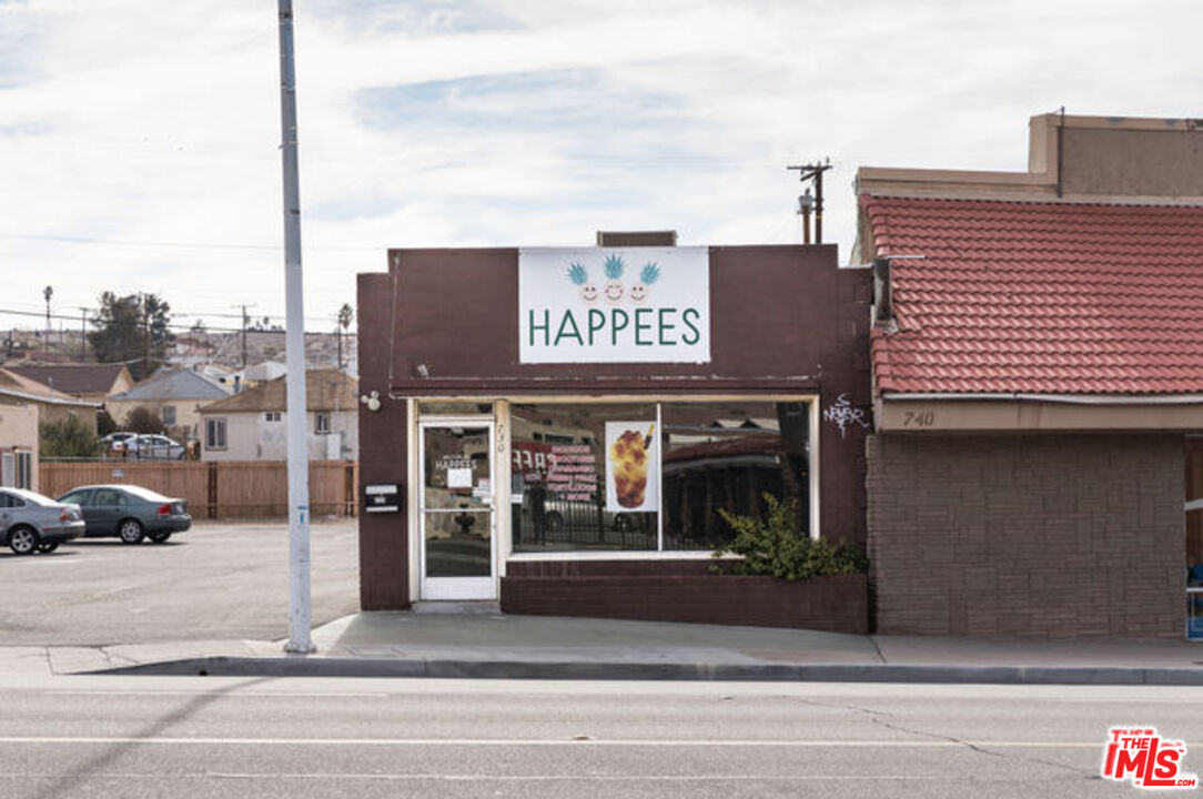 730 Main Street Barstow, CA 92311 - Photo 2 of 12 a view of a building with car parked