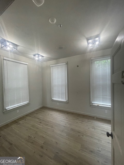 2001 Hamilton Road Columbus, GA 31904 - Photo 11 of 23 an empty room with wooden floor and windows