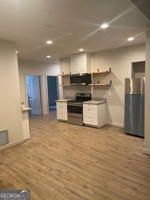 2001 Hamilton Road Columbus, GA 31904 - Photo 8 of 23 a kitchen with stainless steel appliances a refrigerator and a stove top oven
