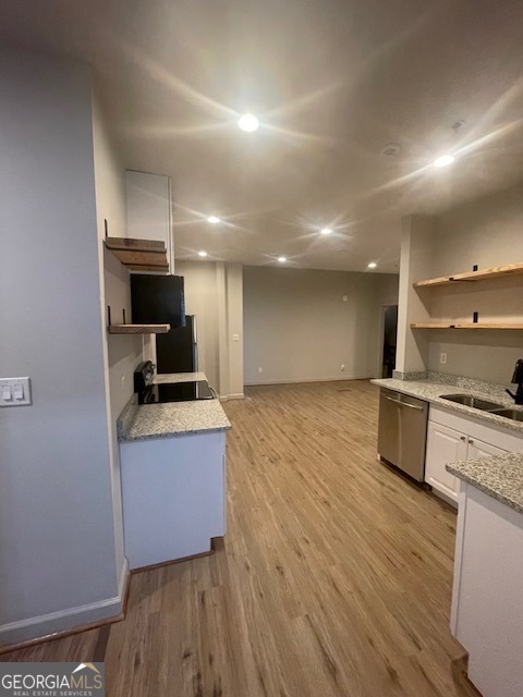 2001 Hamilton Road Columbus, GA 31904 - Photo 9 of 23 a kitchen with stainless steel appliances granite countertop a stove a sink and a refrigerator