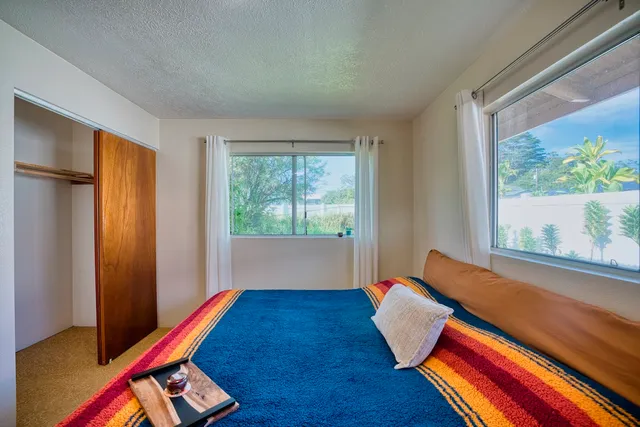 a room with wooden floor and a window