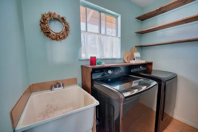 a utility room with dryer and washer