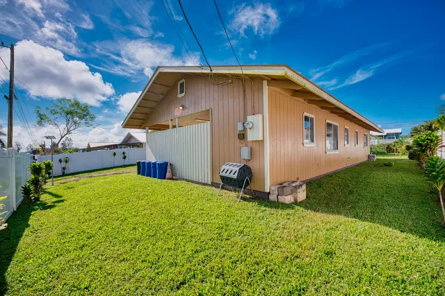 a view of a backyard of the house