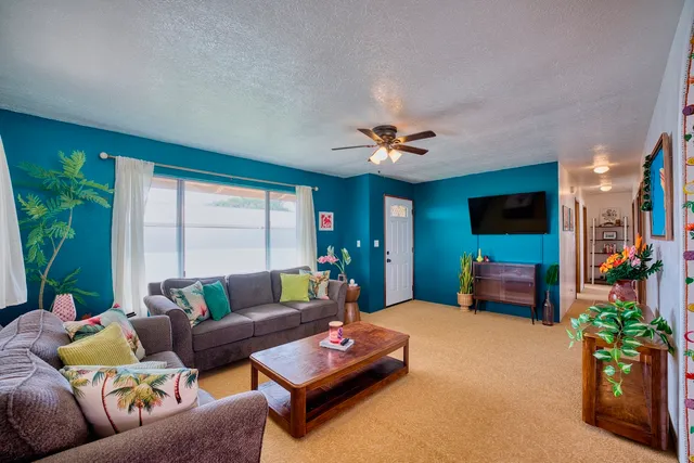 a living room with furniture and a large window