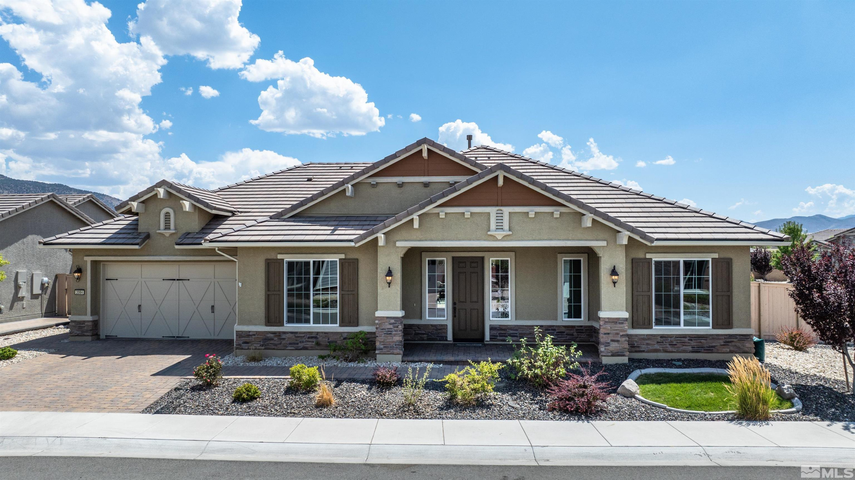 2084 Phaethon Lane Reno, NV 89521 - Photo 1 of 35 a front view of a house with porch
