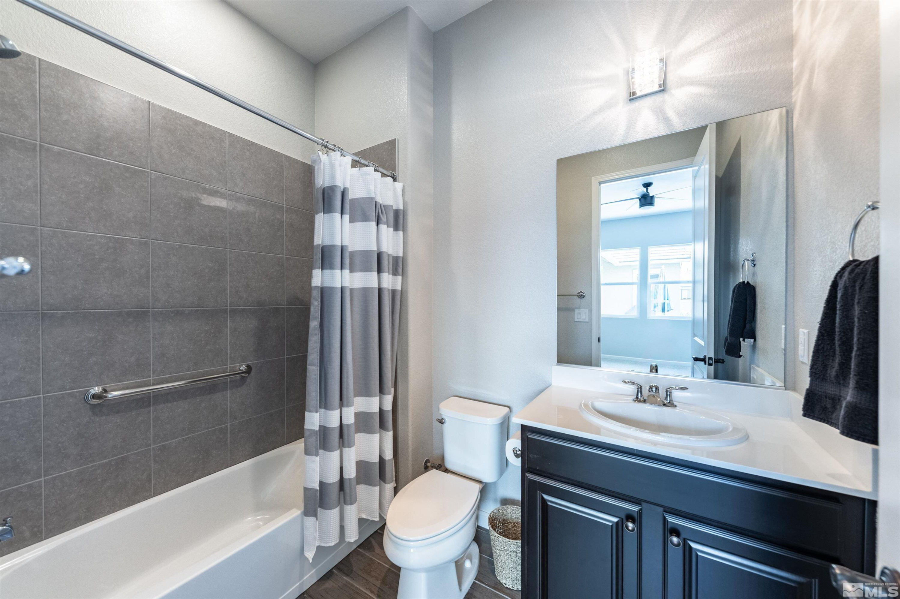 2084 Phaethon Lane Reno, NV 89521 - Photo 15 of 35 a bathroom with a sink a toilet and shower