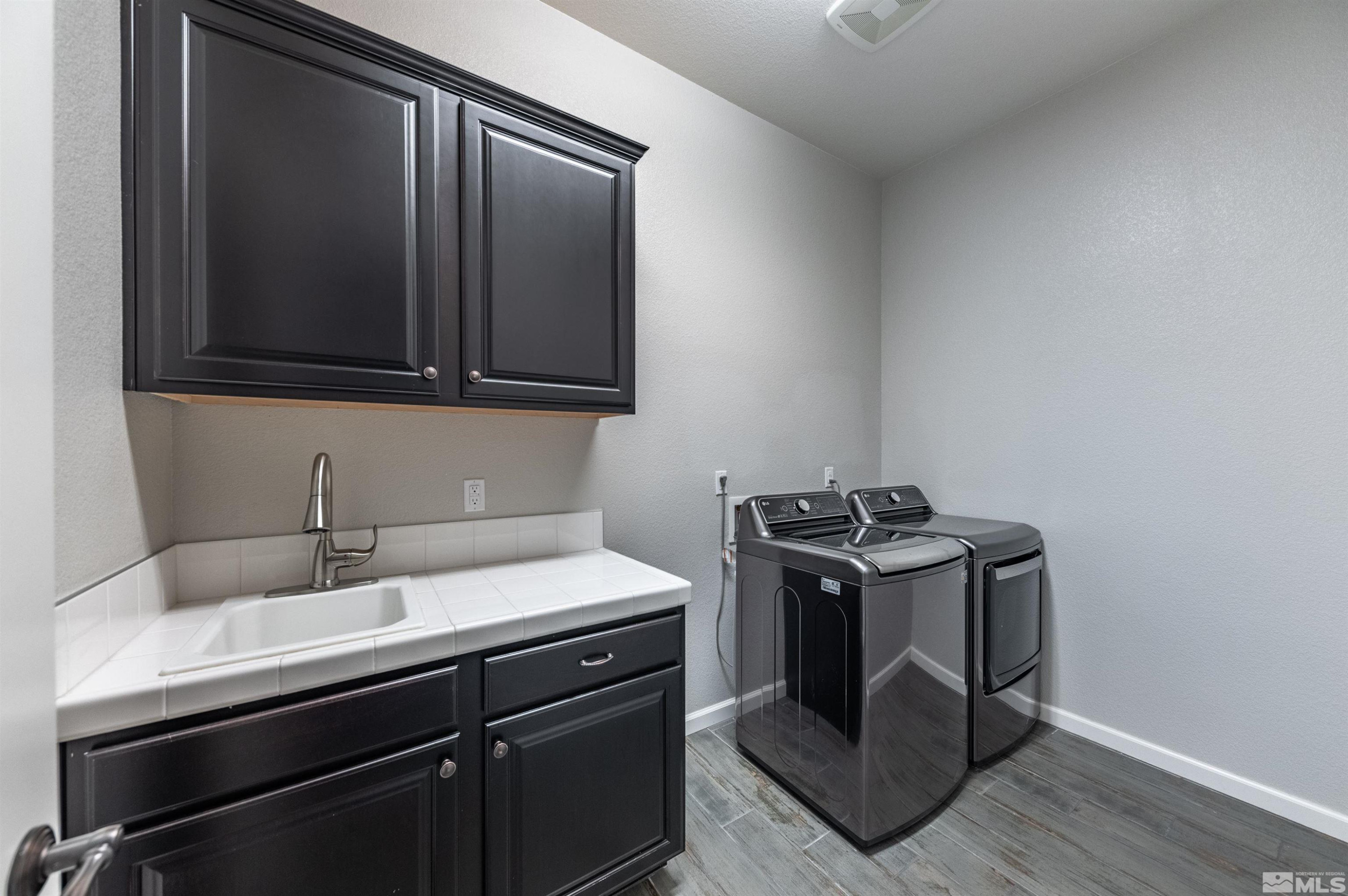 2084 Phaethon Lane Reno, NV 89521 - Photo 16 of 35 a view of a sink and a stove in a kitchen