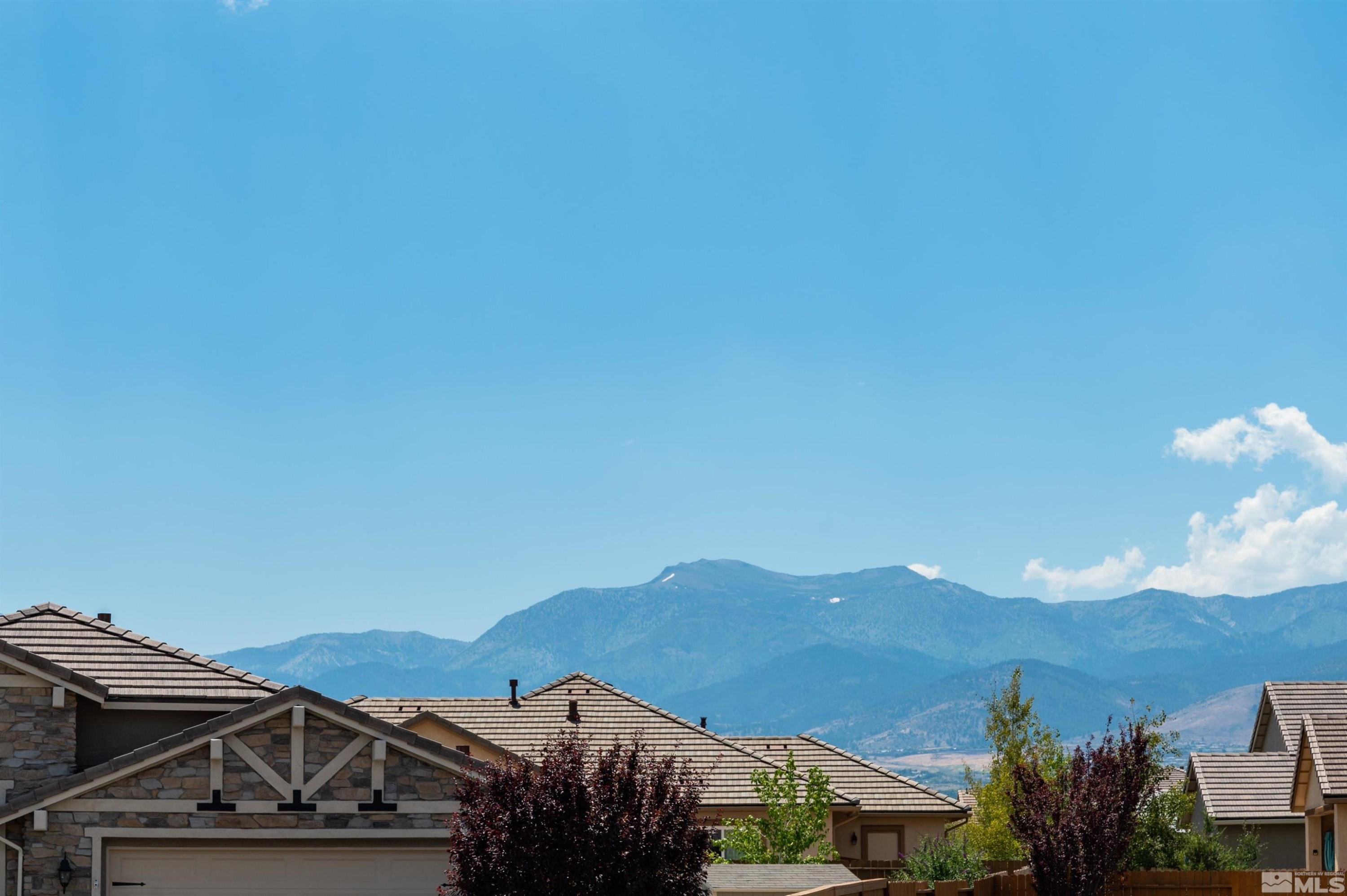 2084 Phaethon Lane Reno, NV 89521 - Photo 22 of 35 a view of a house with a mountain in the background