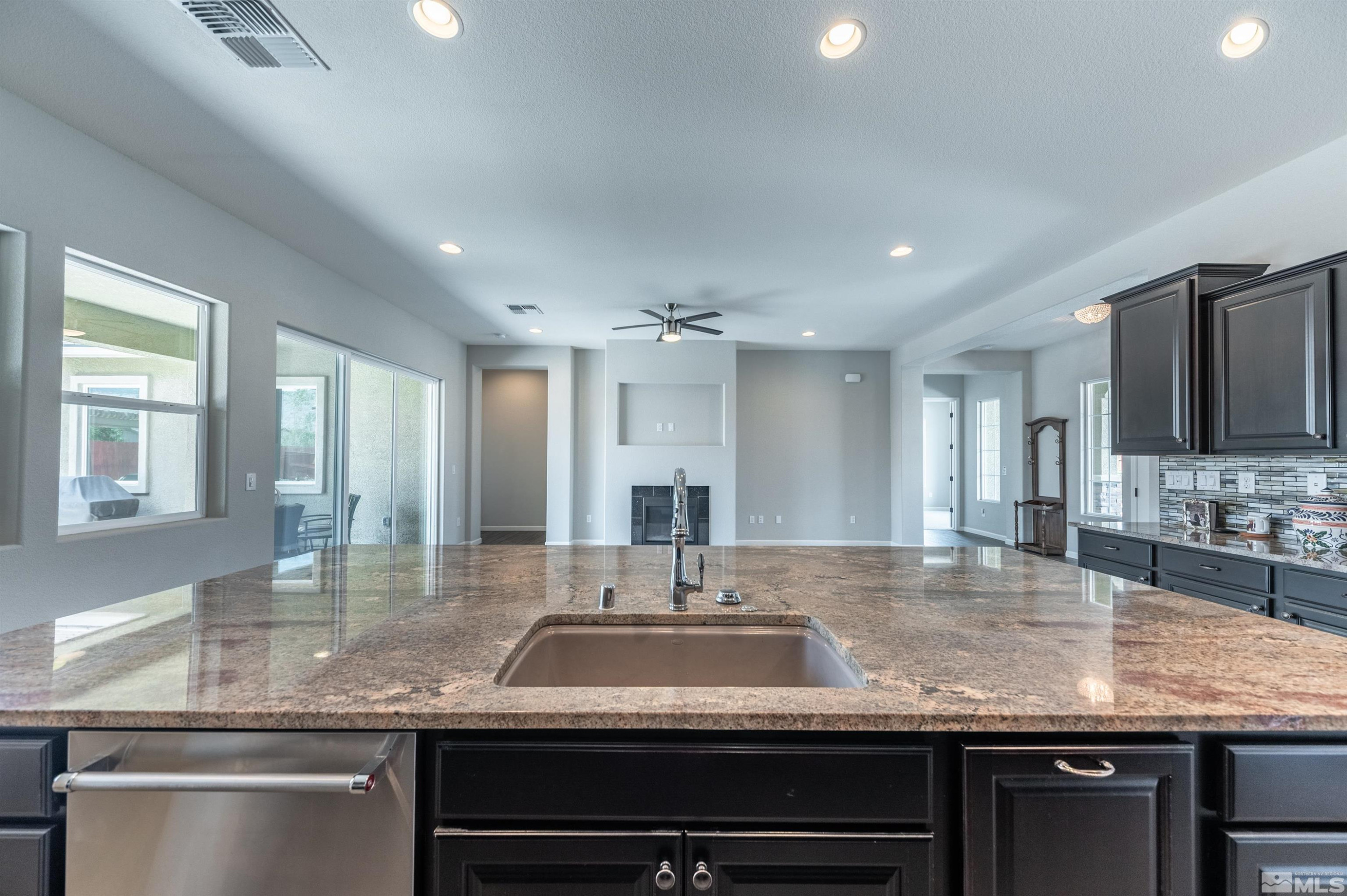2084 Phaethon Lane Reno, NV 89521 - Photo 8 of 35 a view of a kitchen counter top space with granite countertop a sink and dishwasher