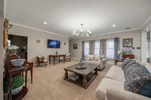 a living room with furniture and a table