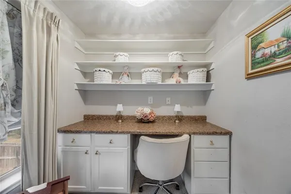 a kitchen with a sink a stove and cabinets