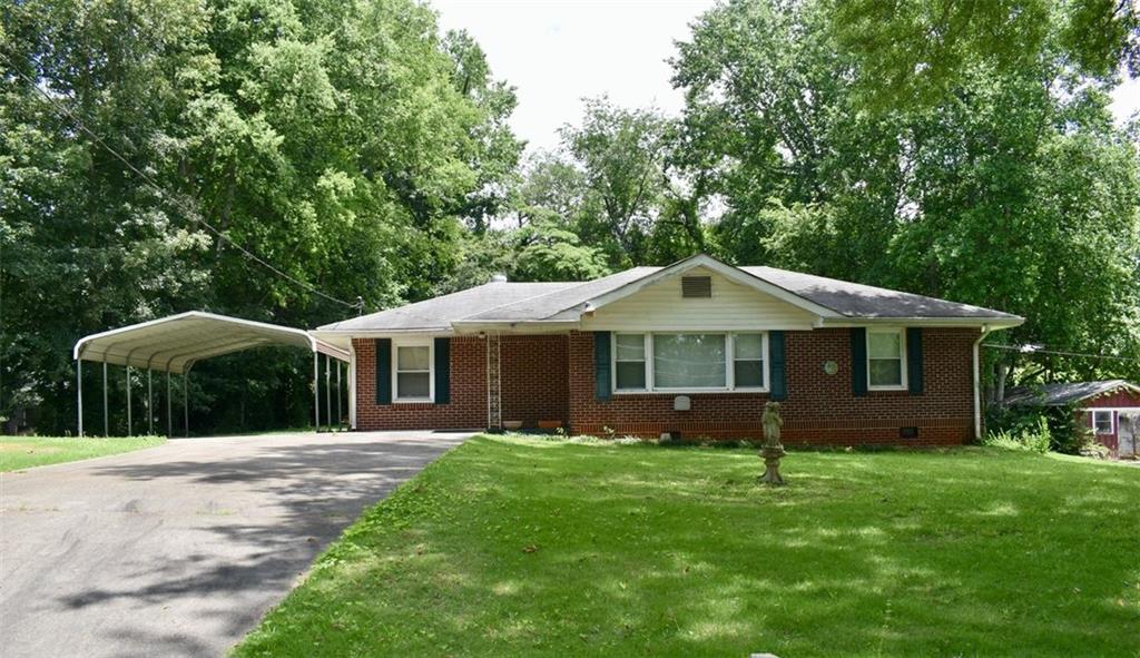 5857 Pinecrest Road Austell, GA 30168 - Photo 1 of 1 a front view of house with yard and green space