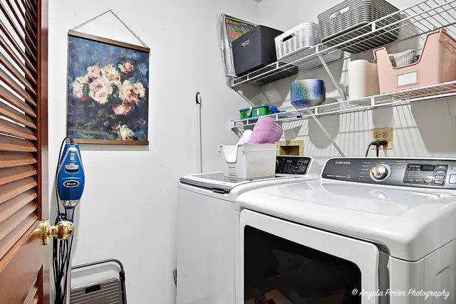 a utility room with dryer and washer
