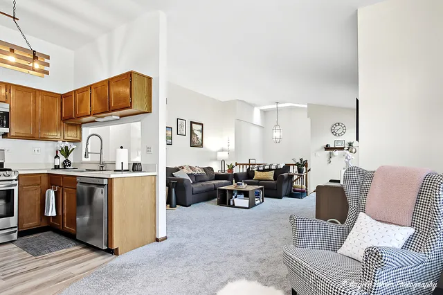 a living room with furniture a couch and a stove top oven