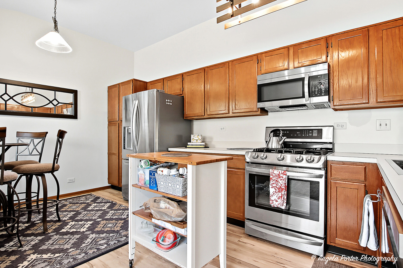 911 Ann Arbor Lane, Unit 253 Vernon Hills, IL 60061 - Photo 9 of 26 a kitchen with stainless steel appliances granite countertop a stove a sink and a microwave