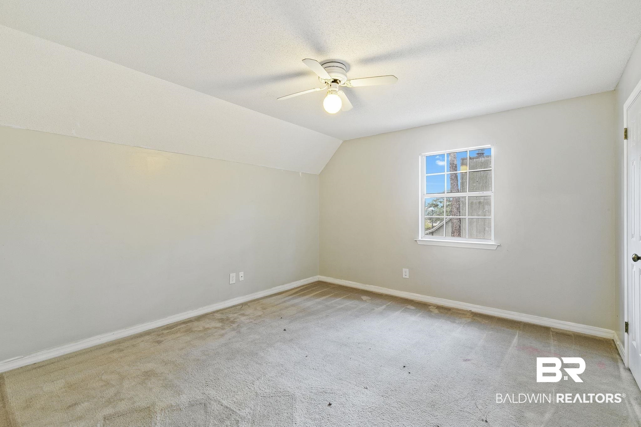 474 Ridgewood Drive Daphne, AL 36526 - Photo 40 of 57 Bonus room featuring vaulted ceiling, light carpet, a textured ceiling, and ceiling fan