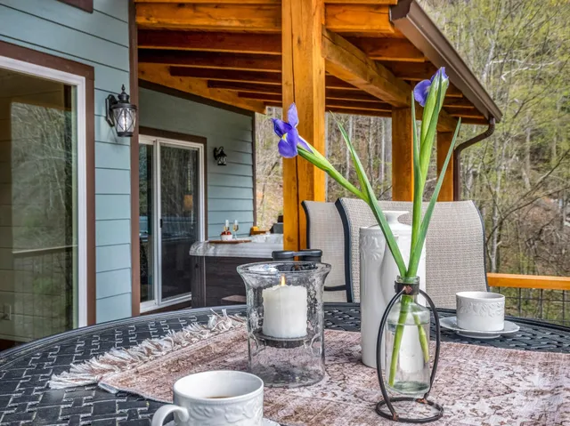 a view of a backyard with sitting area