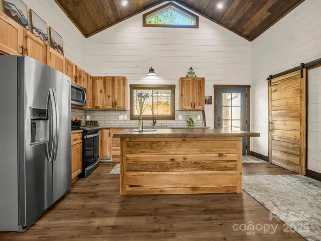 a bed room with a bed and a chair