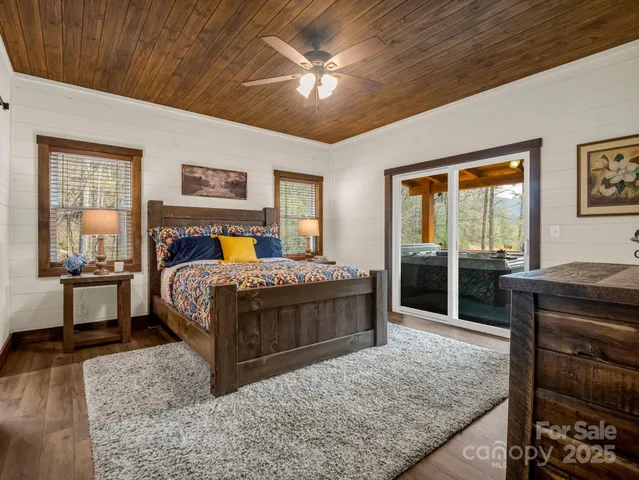 a bedroom with a bed and a table in it