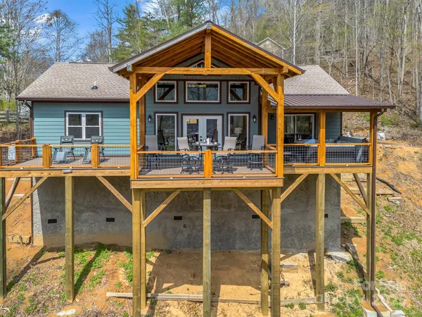 a front view of a house with outdoor seating