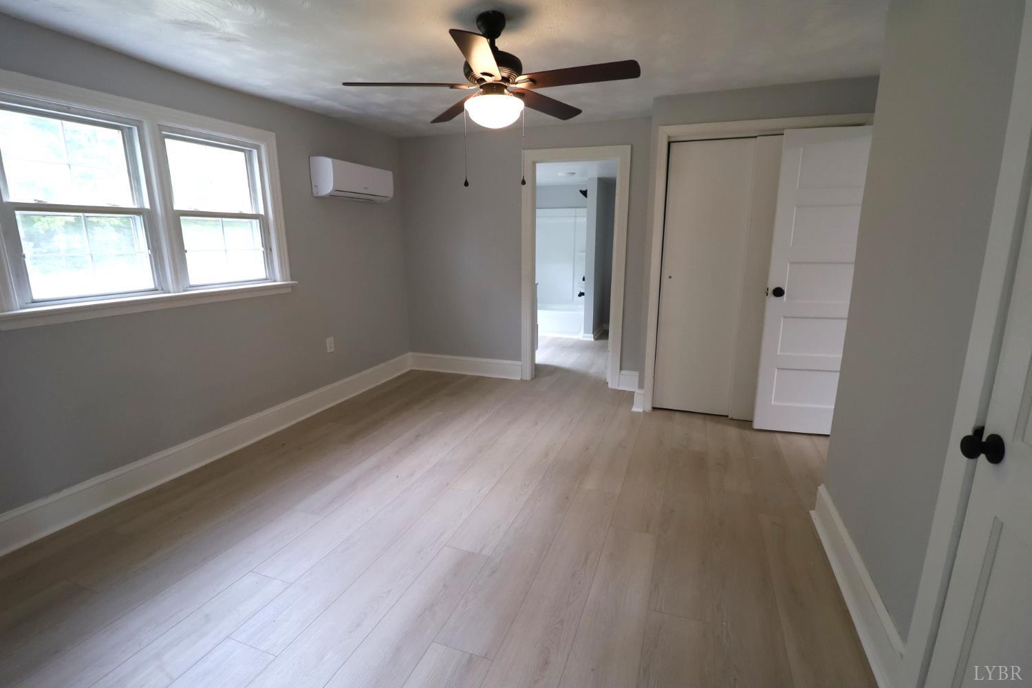 2079 Pin Oak Road Prospect, VA 23960 - Photo 5 of 8 wooden floor in an empty room with a window