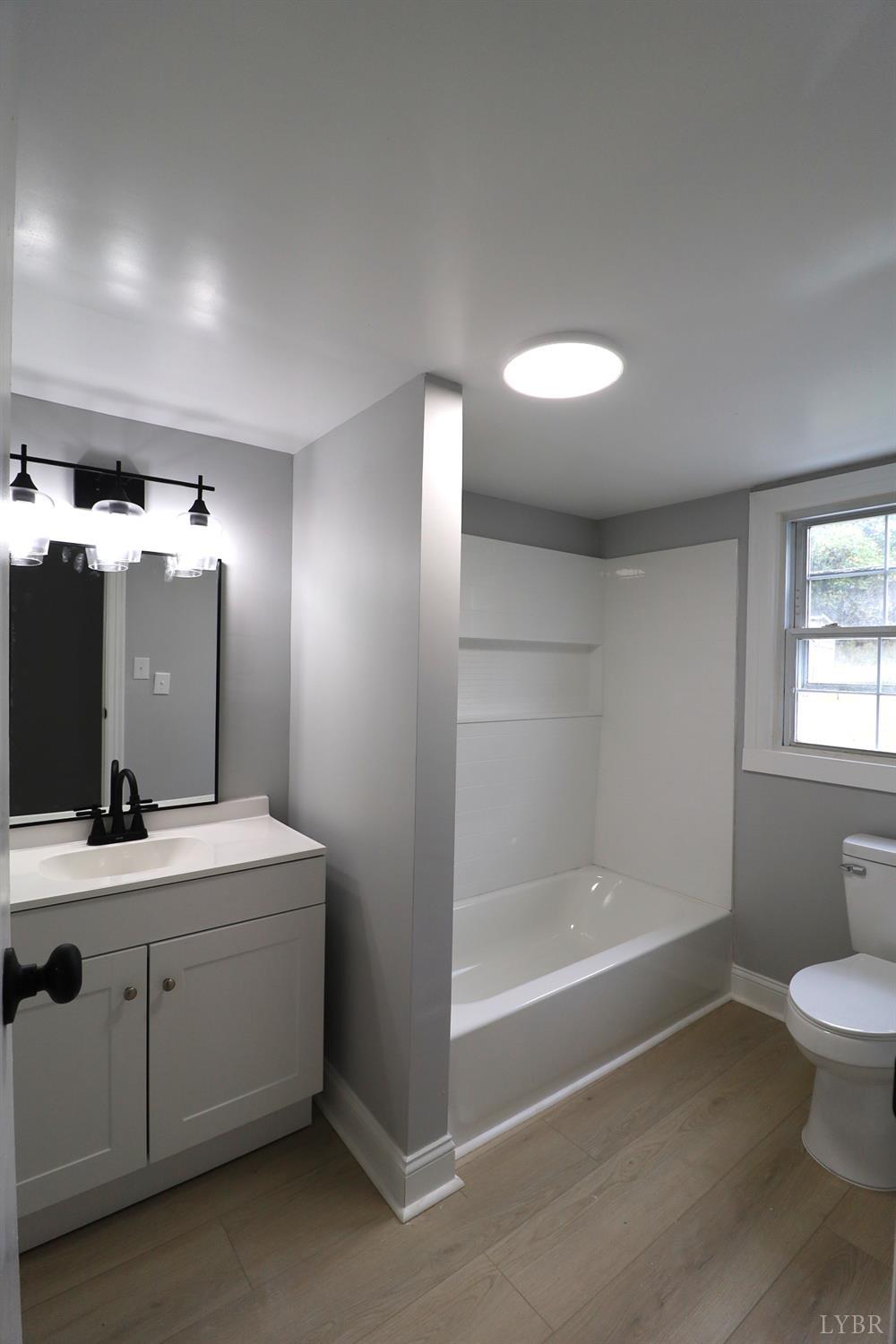 2079 Pin Oak Road Prospect, VA 23960 - Photo 6 of 8 a bathroom with a sink a toilet and shower
