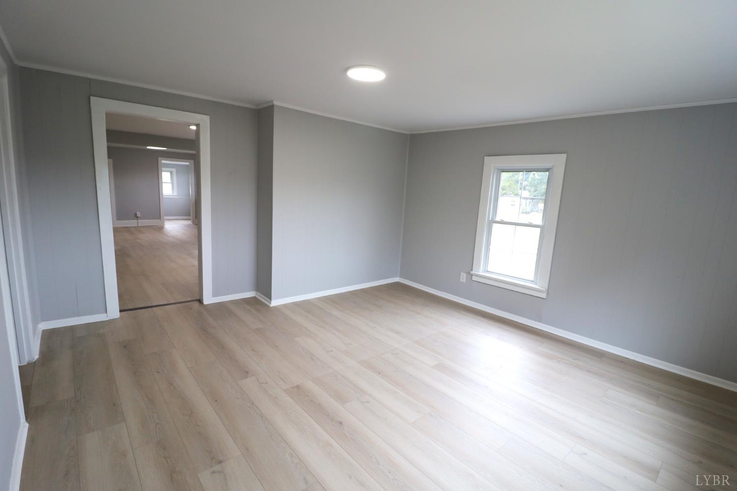 2079 Pin Oak Road Prospect, VA 23960 - Photo 8 of 8 wooden floor in an empty room with a window