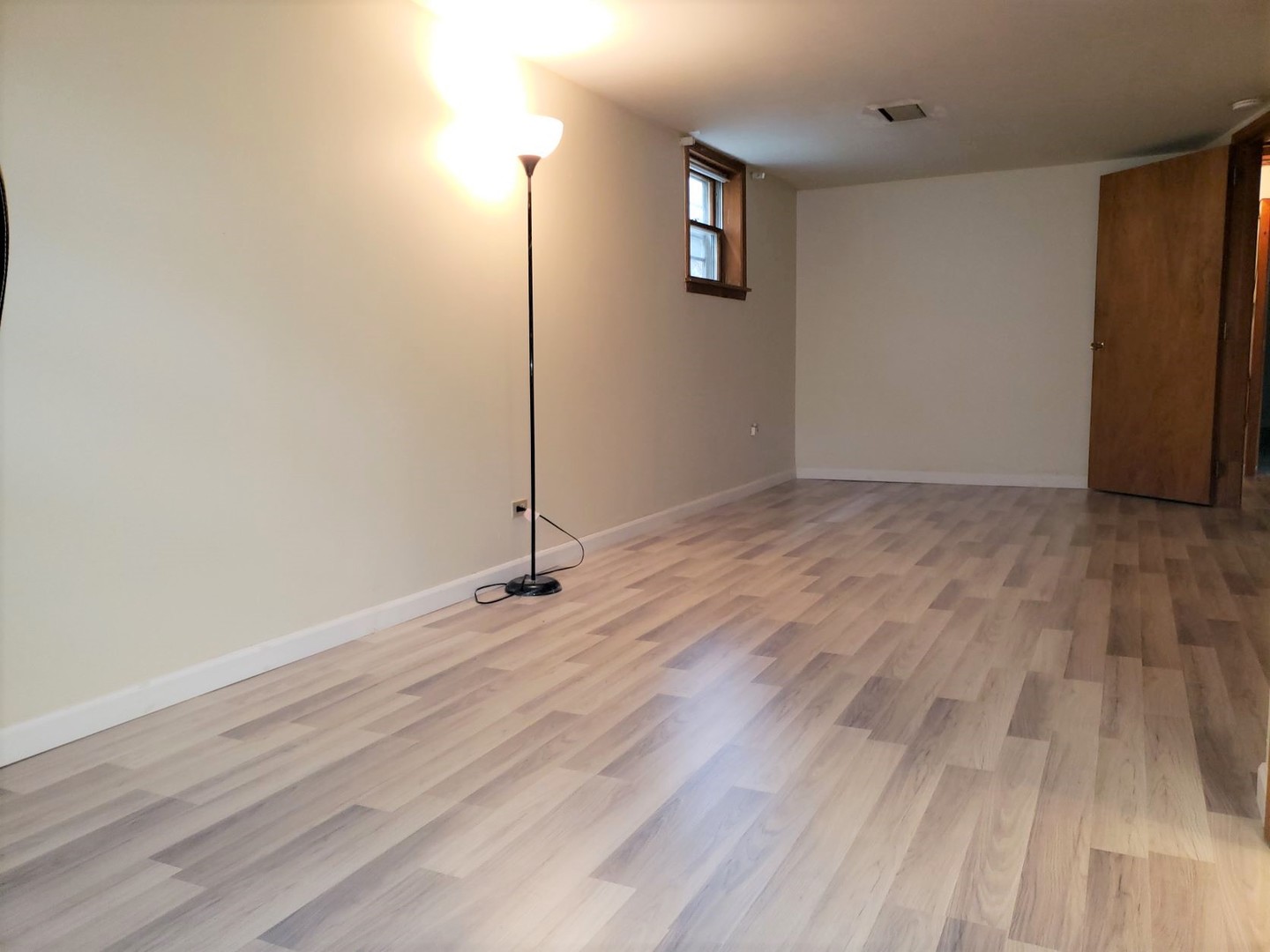 2312 Oakton Street, Unit G Park Ridge, IL 60068 - Photo 11 of 14 a view of an empty room with wooden floor