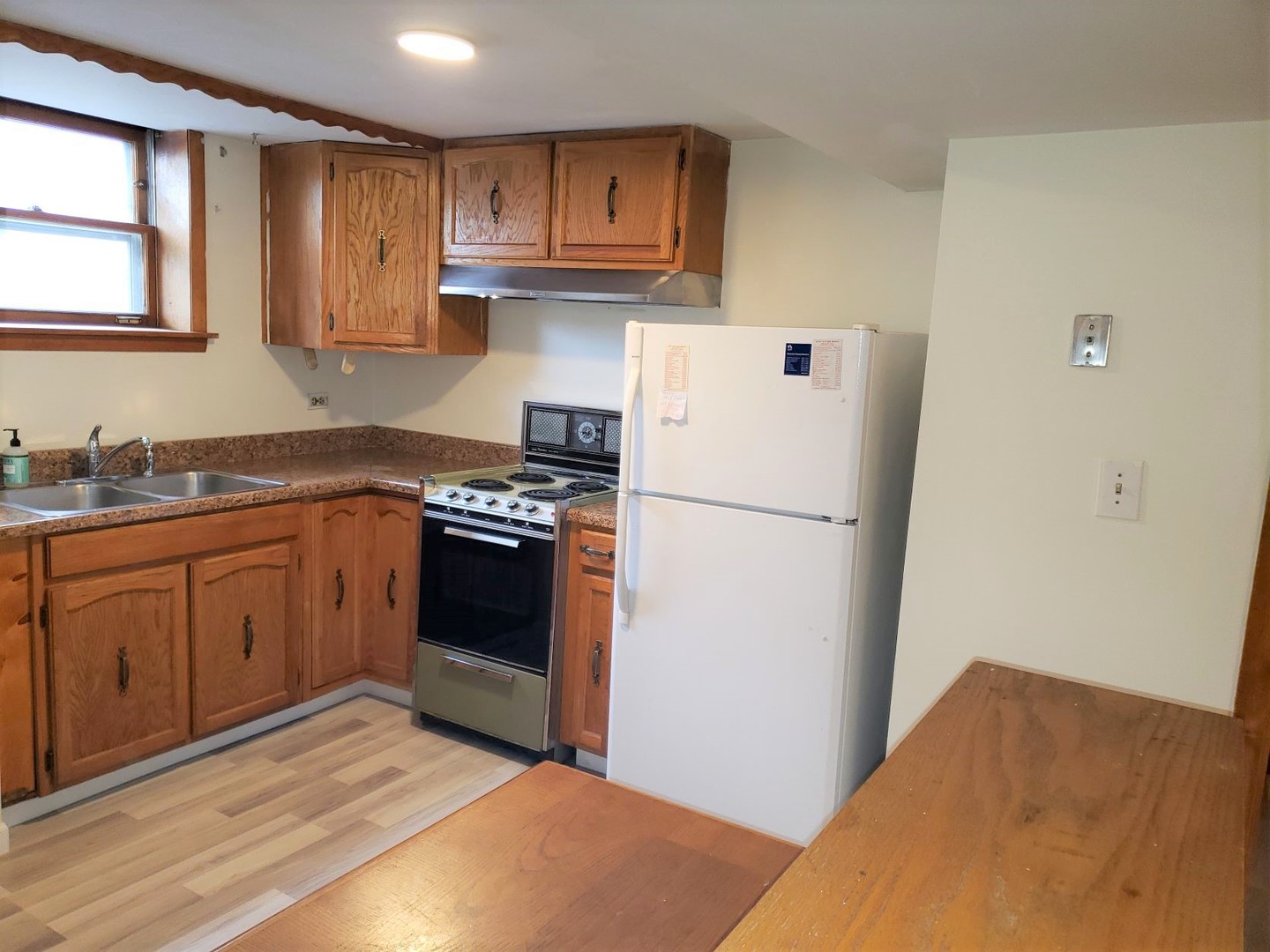 2312 Oakton Street, Unit G Park Ridge, IL 60068 - Photo 6 of 14 a kitchen with stainless steel appliances granite countertop a refrigerator sink and cabinets