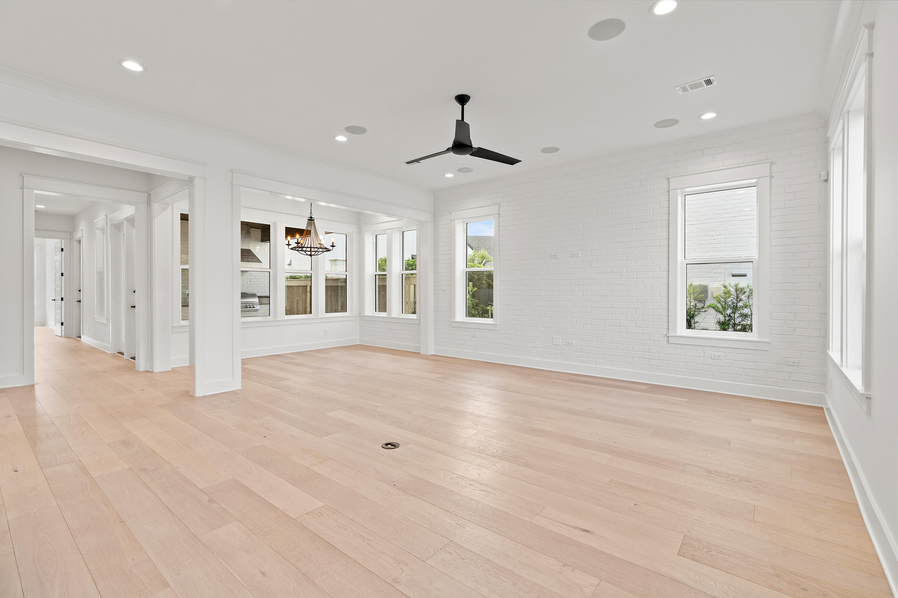 406 Ridgewalk Circle Santa Rosa Beach, FL 32459 - Photo 17 of 69 an empty room with wooden floor and windows