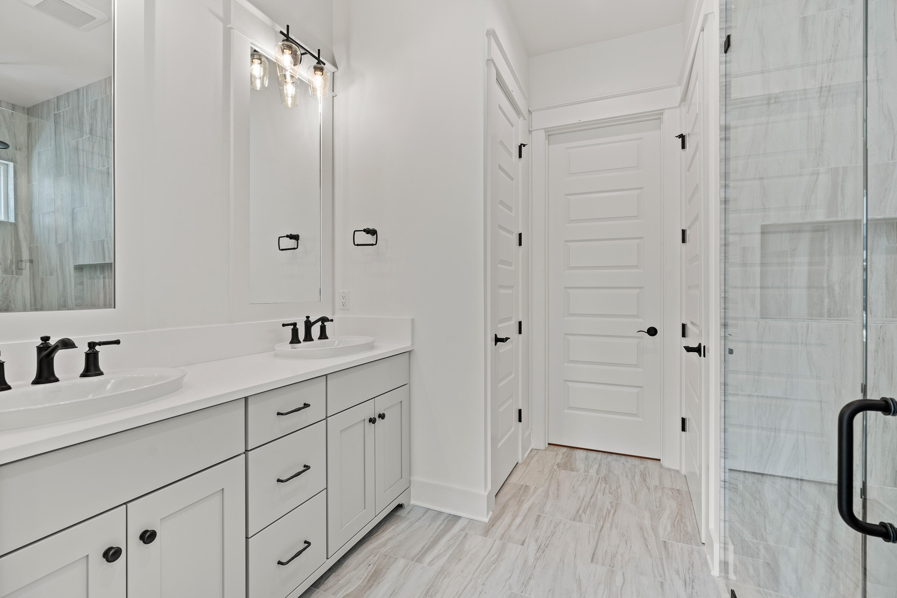 406 Ridgewalk Circle Santa Rosa Beach, FL 32459 - Photo 20 of 69 a bathroom with a double vanity sink a mirror a vanity and a shower